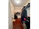 Walk-in closet with wood flooring, wire shelving, and ample storage for clothing and shoes at 4832 Batiste Nw Ln, Acworth, GA 30101