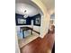Formal dining room featuring hardwood floors, wainscoting, and a stylish light fixture at 4832 Batiste Nw Ln, Acworth, GA 30101