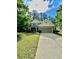Charming two-story home with stone accents, landscaped yard, and a long driveway at 4832 Batiste Nw Ln, Acworth, GA 30101