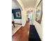 Inviting hallway with hardwood floors, stylish mirror, and a cozy bench seat offers a warm welcome at 4832 Batiste Nw Ln, Acworth, GA 30101