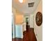 Upstairs hallway featuring wood floors and a decorative round wall hanging at 4832 Batiste Nw Ln, Acworth, GA 30101