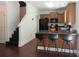 Functional kitchen with dark wood floors, a breakfast bar, and black appliances, perfect for casual dining at 4832 Batiste Nw Ln, Acworth, GA 30101