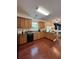Well-lit kitchen with stainless steel appliances, ample counter space, and wood flooring at 4832 Batiste Nw Ln, Acworth, GA 30101