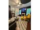 Open-concept living room with a fireplace, large TV, and a blend of furniture for a relaxing atmosphere at 4832 Batiste Nw Ln, Acworth, GA 30101