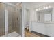 Bathroom featuring a glass shower, double vanity, and tiled floor at 853 Pensive Run, Dacula, GA 30019