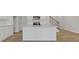 Modern kitchen featuring white cabinets, granite countertops, and stainless steel appliances at 853 Pensive Run, Dacula, GA 30019