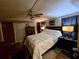 Cozy bedroom featuring a ceiling fan, neutral walls, and carpet flooring at 1720 Valley Ln, Cumming, GA 30040