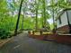 Long driveway leading to a home, lined with brick walls and lush landscaping at 1720 Valley Ln, Cumming, GA 30040