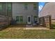 Fenced backyard with a patio area, perfect for outdoor dining and relaxing, providing a private outdoor retreat at 255 Skipjack Ct, Covington, GA 30016