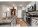 Well-equipped kitchen with modern appliances and granite countertops at 255 Skipjack Ct, Covington, GA 30016