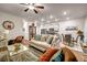 Spacious living room with hardwood floors, modern decor, and an open view of the kitchen and dining area at 255 Skipjack Ct, Covington, GA 30016