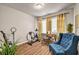 Bright office space with hardwood floors, complemented by a desk, chair, and natural light from a window at 255 Skipjack Ct, Covington, GA 30016