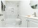 Modern bathroom with white marble tile in shower and floor, sleek vanity, and contemporary fixtures at 2576 Flat Shoals Dr, Decatur, GA 30034