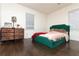 Comfortable bedroom with hardwood floors, soft natural light, and a charming wood dresser at 2576 Flat Shoals Dr, Decatur, GA 30034