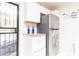 Bright kitchen featuring white cabinets, stainless steel appliances, and tile backsplash accents at 2576 Flat Shoals Dr, Decatur, GA 30034