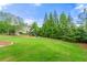 Expansive backyard featuring lush green grass and a charming playset for outdoor fun at 3810 Sweat Creek Run, Marietta, GA 30062