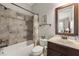 Well-appointed bathroom showcasing a shower-tub combo and stylish vanity with a decorative mirror at 3810 Sweat Creek Run, Marietta, GA 30062