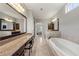 Bathroom with a large vanity with granite countertop and a soaking tub at 3810 Sweat Creek Run, Marietta, GA 30062