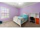 Bright bedroom featuring a bed, desk, and neutral carpet at 3810 Sweat Creek Run, Marietta, GA 30062