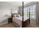 Elegant bedroom featuring a four-poster bed, bright natural light, and neutral decor at 3810 Sweat Creek Run, Marietta, GA 30062