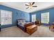 Bright bedroom with blue walls, multiple windows, and a comfortable double bed at 3810 Sweat Creek Run, Marietta, GA 30062
