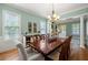 Formal dining room with a large wooden table, elegant chandelier, and stylish décor at 3810 Sweat Creek Run, Marietta, GA 30062