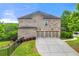 Stunning brick home with a four-car garage and well-maintained landscaping at 3810 Sweat Creek Run, Marietta, GA 30062