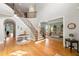 Spacious foyer featuring hardwood floors, curved staircase, and a view into the inviting living room at 3810 Sweat Creek Run, Marietta, GA 30062