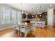 Bright kitchen and dining area with wooden floors, a large window, and stainless steel appliances at 3810 Sweat Creek Run, Marietta, GA 30062