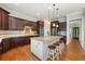 Spacious kitchen features a large island with seating, granite countertops, and stainless steel appliances at 3810 Sweat Creek Run, Marietta, GA 30062