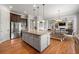 Modern kitchen boasts stainless steel appliances, a large island, and an adjacent dining area for Gathering meals at 3810 Sweat Creek Run, Marietta, GA 30062