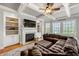 Comfortable living room features a fireplace, built-in shelving, and a large sectional sofa at 3810 Sweat Creek Run, Marietta, GA 30062