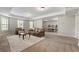 Open-concept living room flows seamlessly into a dining area, great for Gathering gatherings and entertaining guests at 3810 Sweat Creek Run, Marietta, GA 30062