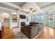 Cozy living room features a tray ceiling, fireplace, built-in shelving, and outdoor access at 3810 Sweat Creek Run, Marietta, GA 30062