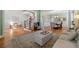 Open-concept living area seamlessly connects the foyer, living room, and dining room with green walls at 3810 Sweat Creek Run, Marietta, GA 30062