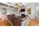 An open-concept living room features built-in bookcases, a fireplace, and coffered ceiling at 3810 Sweat Creek Run, Marietta, GA 30062