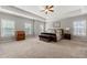 Spacious main bedroom featuring tray ceiling, windows, neutral colors and carpet at 3810 Sweat Creek Run, Marietta, GA 30062