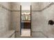 Walk-in shower featuring decorative tile surround with a built-in bench at 3810 Sweat Creek Run, Marietta, GA 30062
