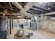 Spacious unfinished basement with equipment, providing potential for storage or renovation at 25 Standish Nw Ave, Atlanta, GA 30309