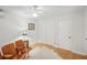Clean bedroom with hardwood floors, closet space, and bright neutral paint at 25 Standish Nw Ave, Atlanta, GA 30309