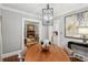 Dining room with hardwood floors and a view of the living room's fireplace and kitchen at 25 Standish Nw Ave, Atlanta, GA 30309