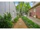 Gravel walkway between two homes leading to gate at 25 Standish Nw Ave, Atlanta, GA 30309