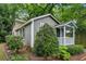 View of home with mature trees and landscaped yard at 25 Standish Nw Ave, Atlanta, GA 30309