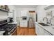 Bright kitchen with marble counters, stainless steel appliances and beautiful hardwood floors at 25 Standish Nw Ave, Atlanta, GA 30309
