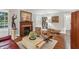 Inviting living room with fireplace, hardwood floors, leather chairs, and sophisticated decor at 25 Standish Nw Ave, Atlanta, GA 30309