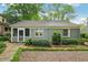 Charming rear exterior of a cozy home with a well-maintained yard and landscape at 25 Standish Nw Ave, Atlanta, GA 30309