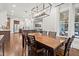 Open concept dining area connecting to a well-lit kitchen and living space at 3668 Spring St, Chamblee, GA 30341