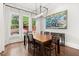 Bright dining room with large windows, chandelier, and hardwood floors at 3668 Spring St, Chamblee, GA 30341