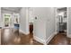 Open-concept hallway showcases hardwood floors connecting to kitchen, bathroom and living area at 3668 Spring St, Chamblee, GA 30341