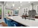 Modern kitchen featuring a large island with seating and pendant lighting at 3668 Spring St, Chamblee, GA 30341